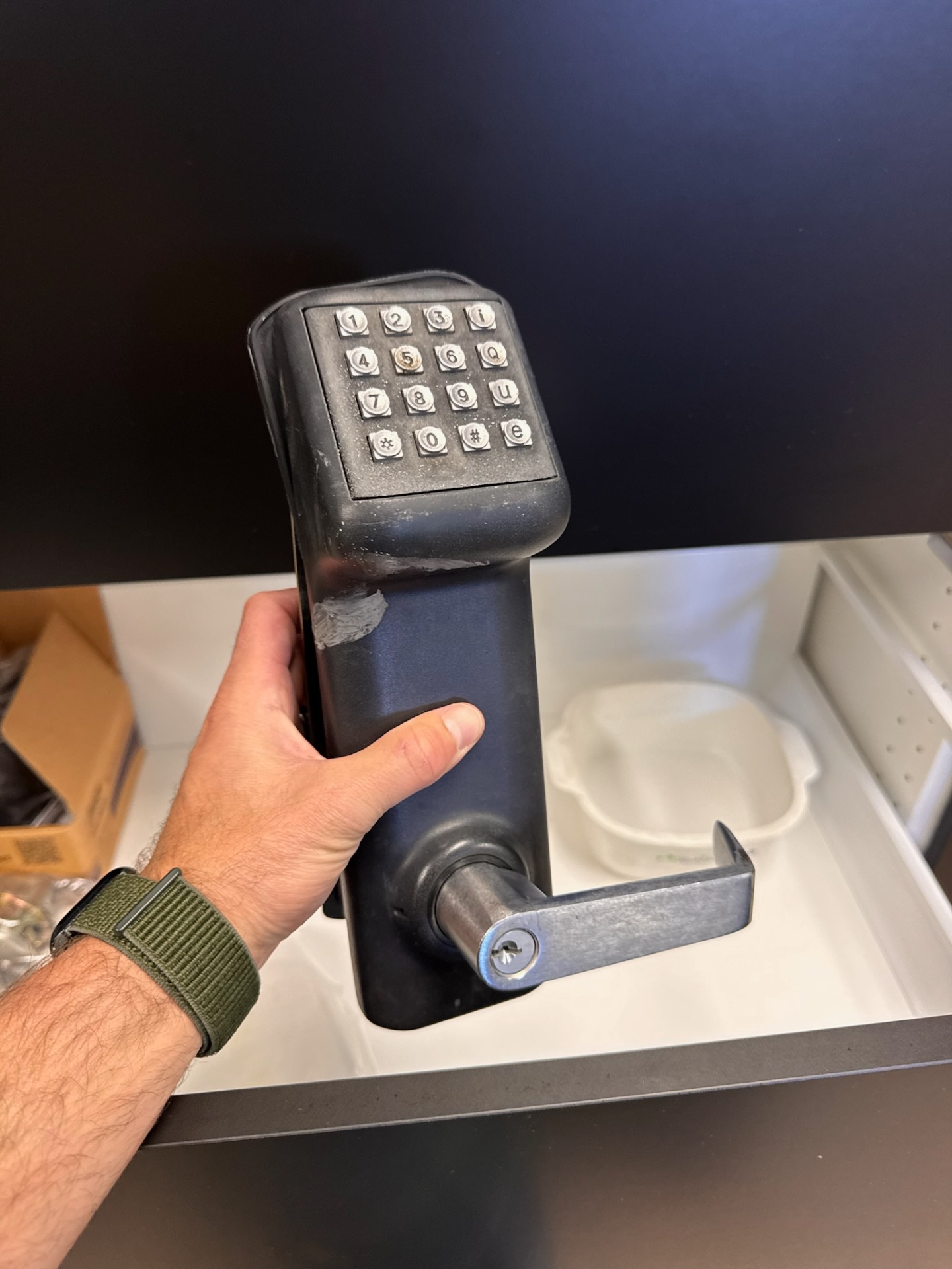 Commercial metal door with a silver numeric keypad lock, key cylinder, lever handle, rust, and exposed mounting holes. - view 6