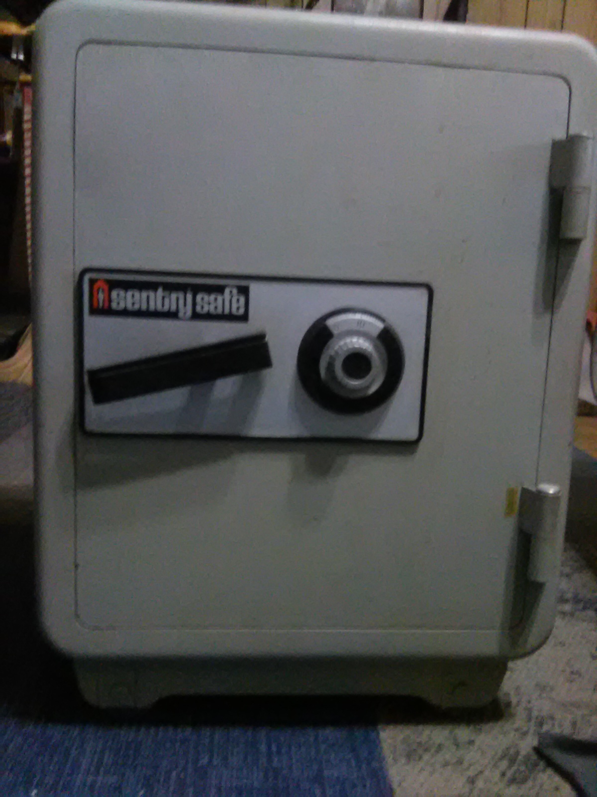 Gray safe door in Broomfield with a combination dial, horizontal handle, and visible centry safe label