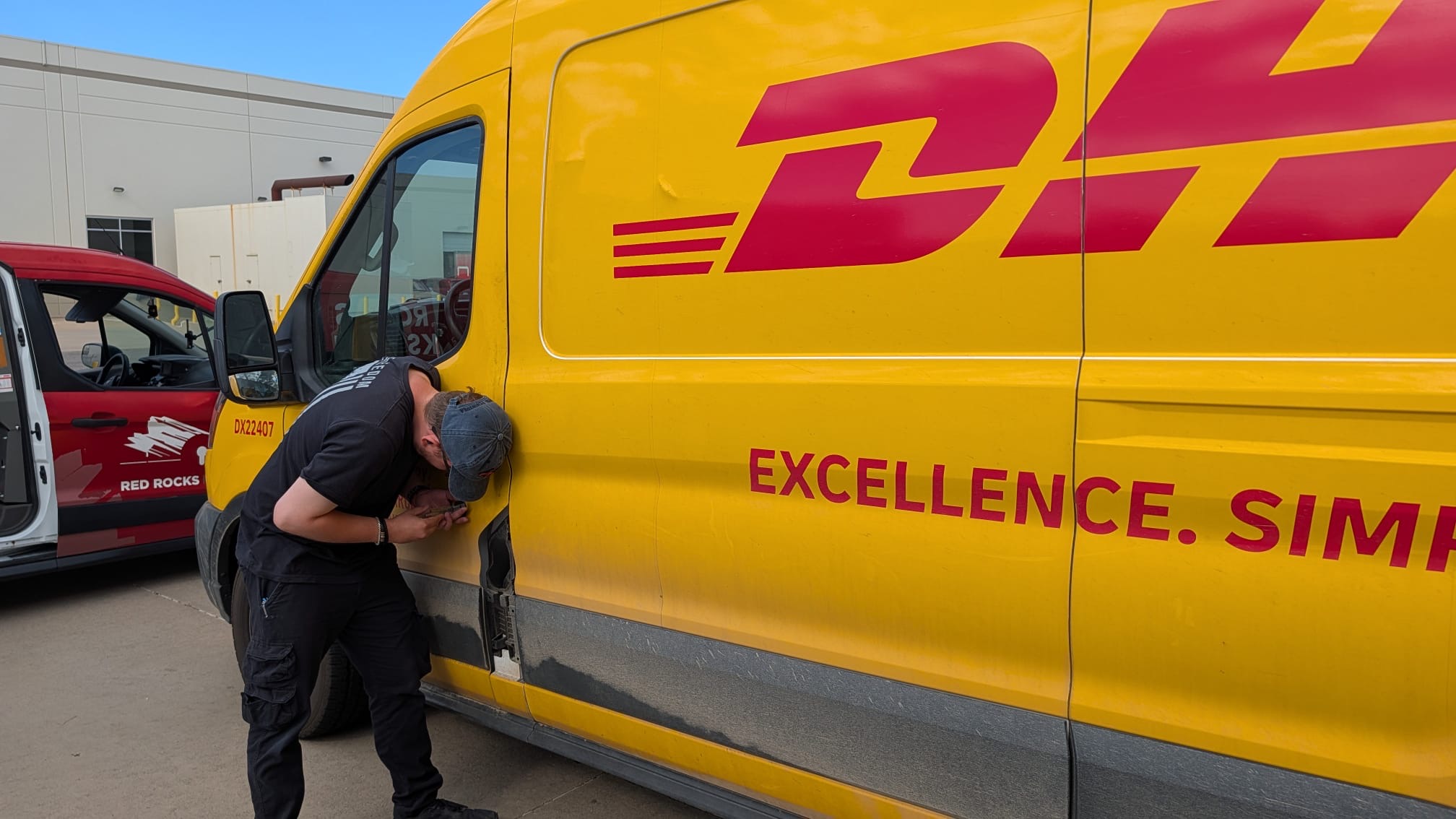 Commercial Van Locksmith Doing Lock Service on a Van